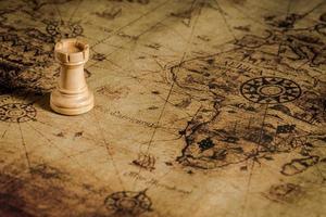 chess figure on map background concept for ideas photo