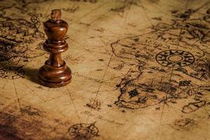 chess figure on map background concept for ideas photo