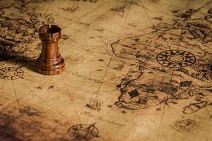 chess figure on map background concept for ideas photo