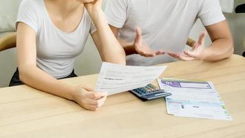 Men and women are in debt with credit cards invoices. photo