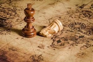 chess figure on map background concept for ideas photo