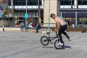 BRISTOL, UK, 2019. Bicycle stunts in Millennium Square photo