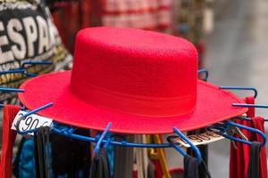 GRANADA, ANDALUCIA, SPAIN, 2014.  Red hat for sale photo