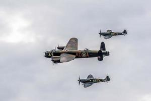 SHOREHAM-BY-SEA, UK, 2014. Avro Lancaster Flanked by Two Spitfires photo