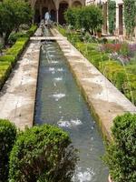 GRANADA, ANDALUCIA, SPAIN, 2014. View of a fountain in the Alhambra Palace gardens photo