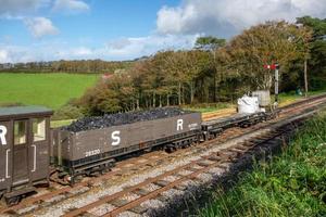 WOODY BAY, DEVON, UK, 2013. Coal wagon on the Lynton and Barnstaple Steam Railway line photo