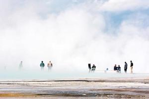 GRAND PRISMATIC SPRING, YELLOWSTONE, USA, 2013. People at the Grand Prismatic Spring photo