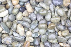 pebble stones background. closeup of stones texture photo