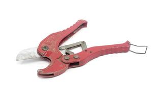 red old scissors for cutting plastic pipe photo
