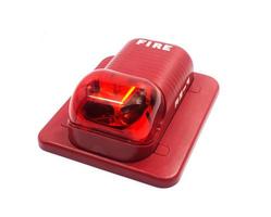 A fire alarm with built in strobe light to alert in case of fire. photo