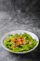 Stir Fry Snow Peas with Vietnamese Grilled Pork Sausage, topping with crispy fried shallots and garlics photo