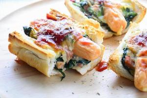Baked Spinach with Cheese, sausage on Baguette, French bread photo