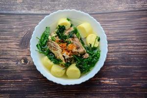 Ivy gourd soup with Soft white bean curd and pork bone photo