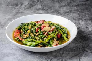 Fried water spinach with barbecued red pork photo