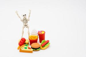 Skeleton and foods, enjoy eating until death photo