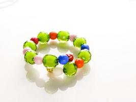 Multi-colored bracelets with beads. Colourful child's bead bracelet. photo