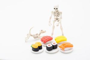 Skeleton, dog and foods, enjoy eating until death