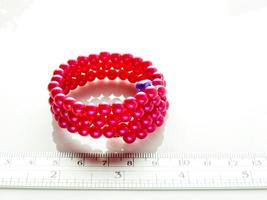 Multi-colored bracelets with beads. Colourful child's bead bracelet. photo