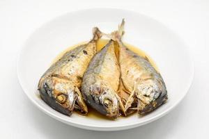 Fried mackerel on white plate. Deep fried fish photo