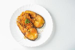 Deep Fried Pangasius fish with Black Pepper Garlic and fish source, quick and easy dish. photo