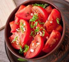 tomato salad with basil, black pepper and garlic photo