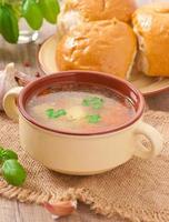 Chicken soup in the brown ceramic bowl photo