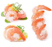 Two tail of shrimp with fresh lemon and rosemary on the white photo