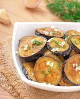 Platter of grilled eggplant with garlic and dill photo