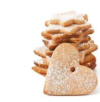 Homemade Christmas cookies sprinkled with powdered sugar photo