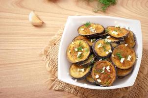 Platter of grilled eggplant with garlic and dill photo