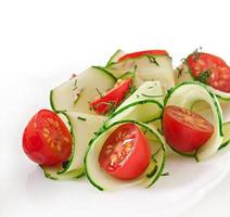 Fresh salad with tomatoes and cucumbers photo