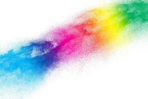 Multicolored particles explosion on white background. Colorful dust splatter on white background. photo