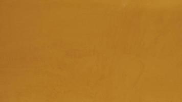 Orange cement surface, abstract pattern, the background can be used as screen saver, wall paper or background with copy space. photo