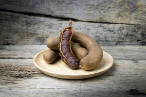 tamarind on grunge wooden background photo