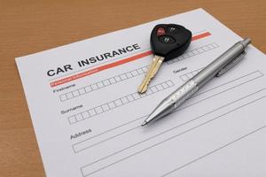 motor insurance with car key and pen photo