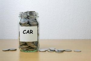 Money saving for car in the glass bottle photo