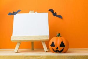 Halloween Pumpkins on wooden table photo