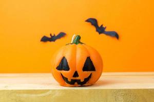 Halloween Pumpkins on wooden table photo