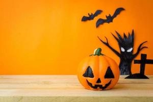 Halloween Pumpkins on wooden table photo