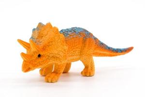 Triceratops toy model on white background photo