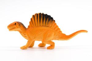 modelo de juguete spinosaurus sobre fondo blanco foto