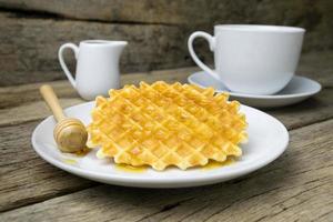 waffle with a cup of Coffee and honey photo