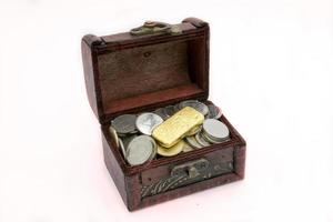 Old wooden chest with golden coins photo