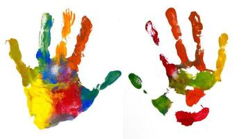 Hands Kid painted, stamped on paper, isolated on white photo