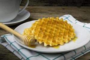 waffle with a cup of Coffee and honey photo