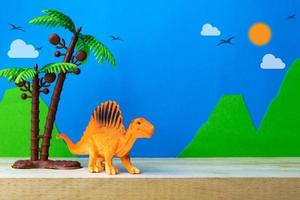 Spinosaurus toy model on wild models background photo