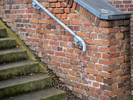 staircase with a brick wall photo