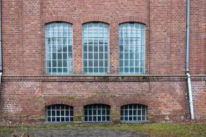 Brick building with glass windows outdoors photo