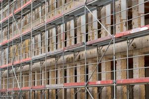Construction site house with scaffolding photo