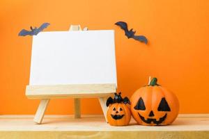 Halloween Pumpkins on wooden table photo